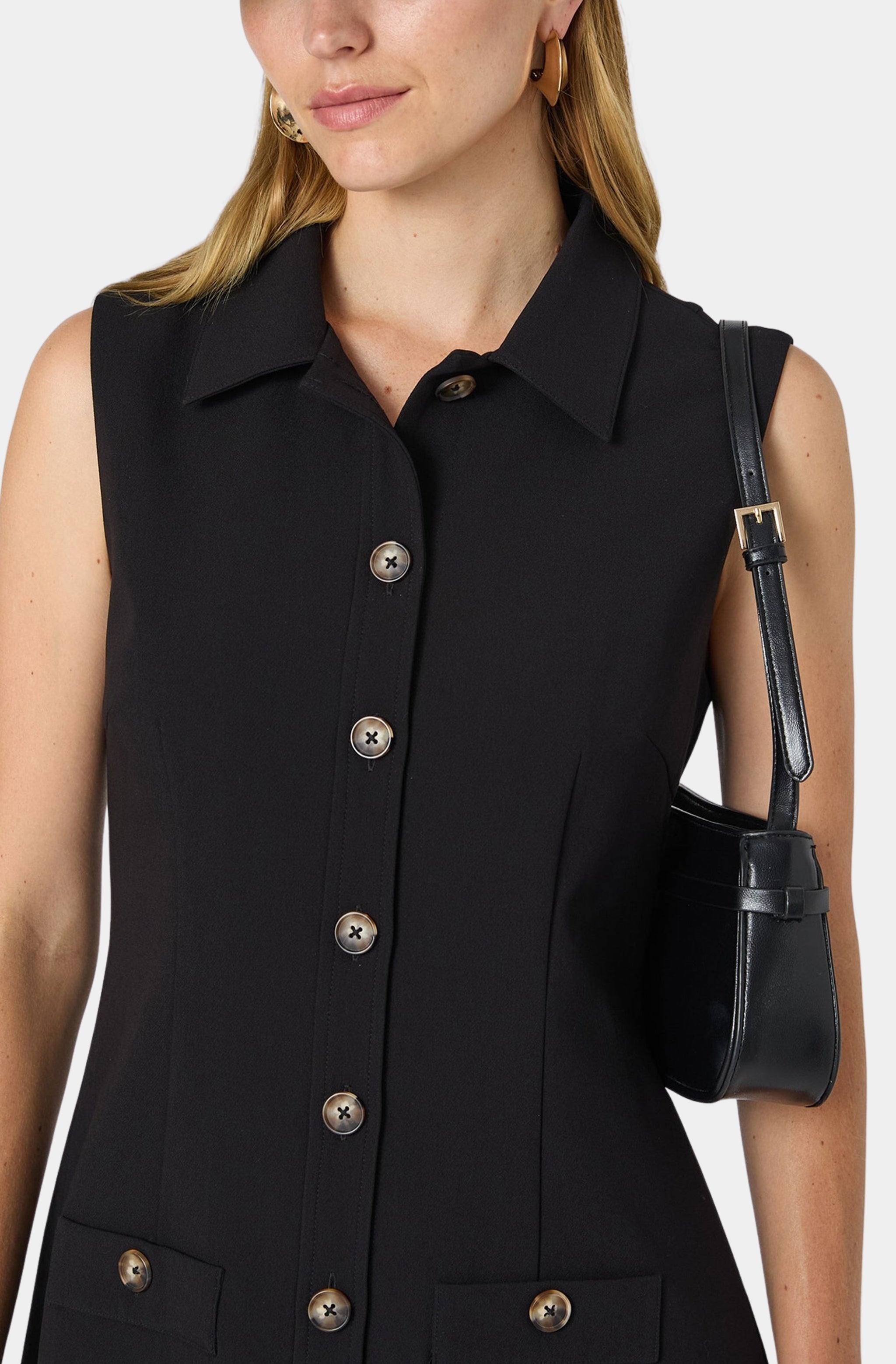 Close-up of black twill dress with handbag