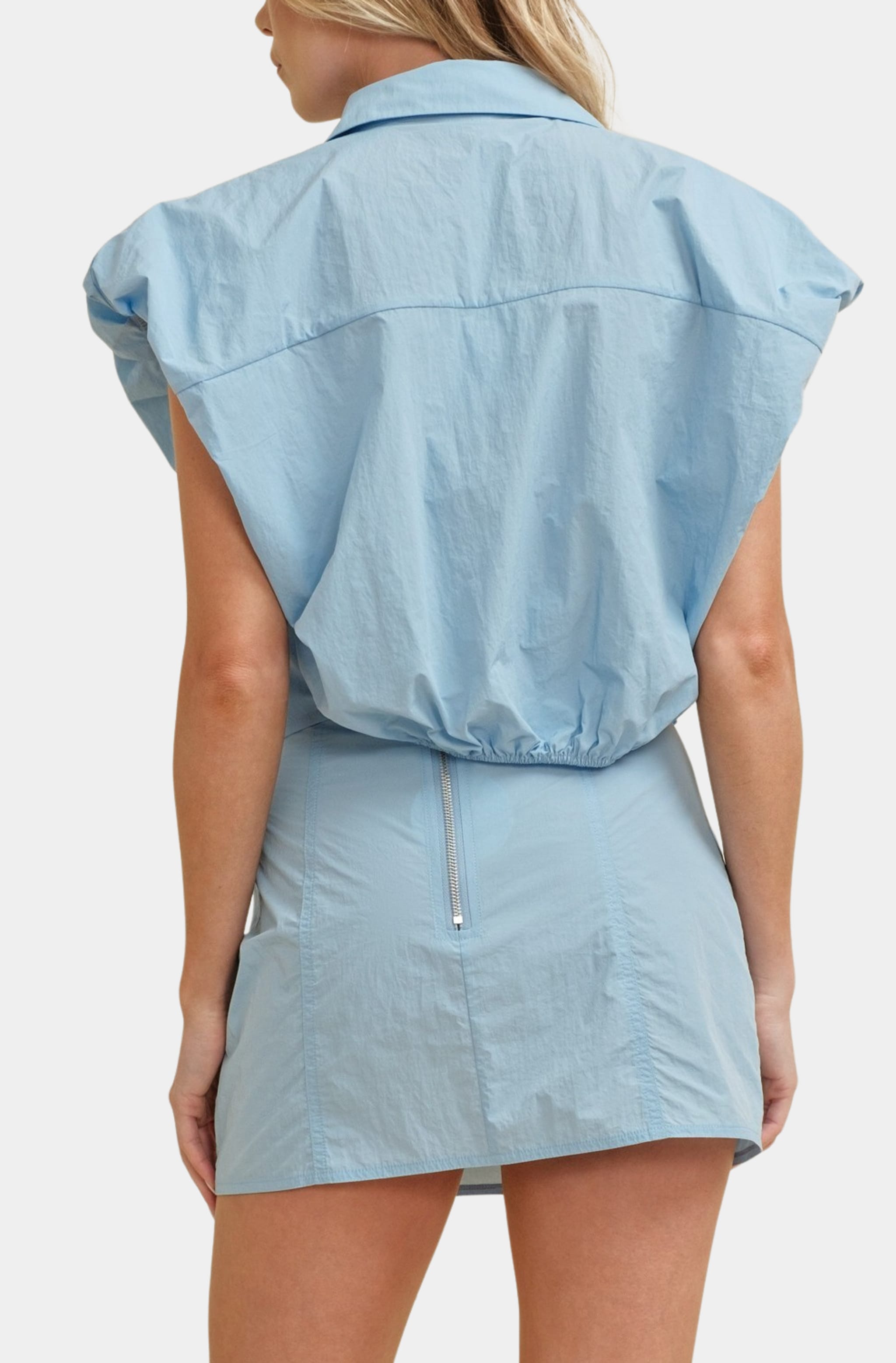 Back view of light blue Nanette Top with bubble hem