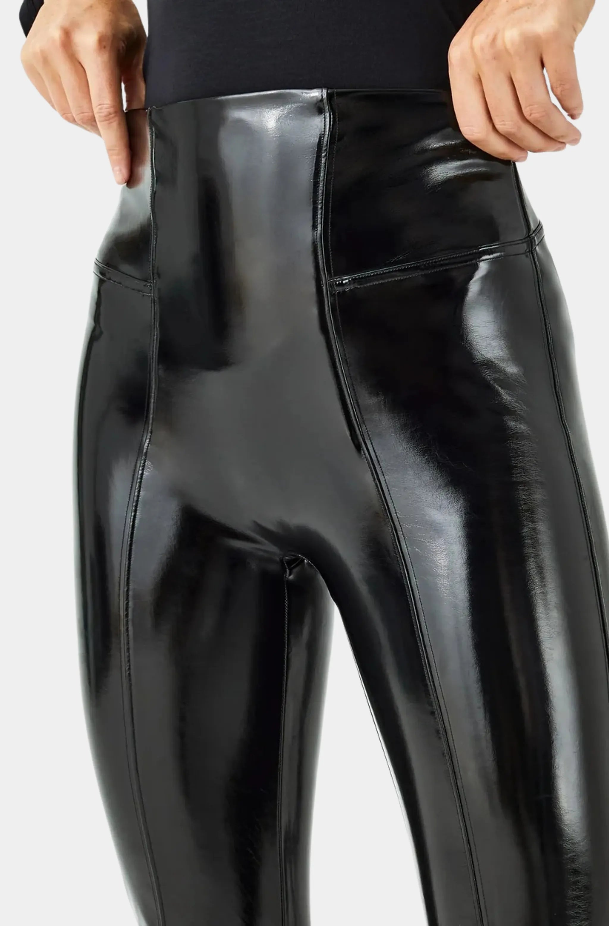 Detail of high-waisted faux leather leggings
