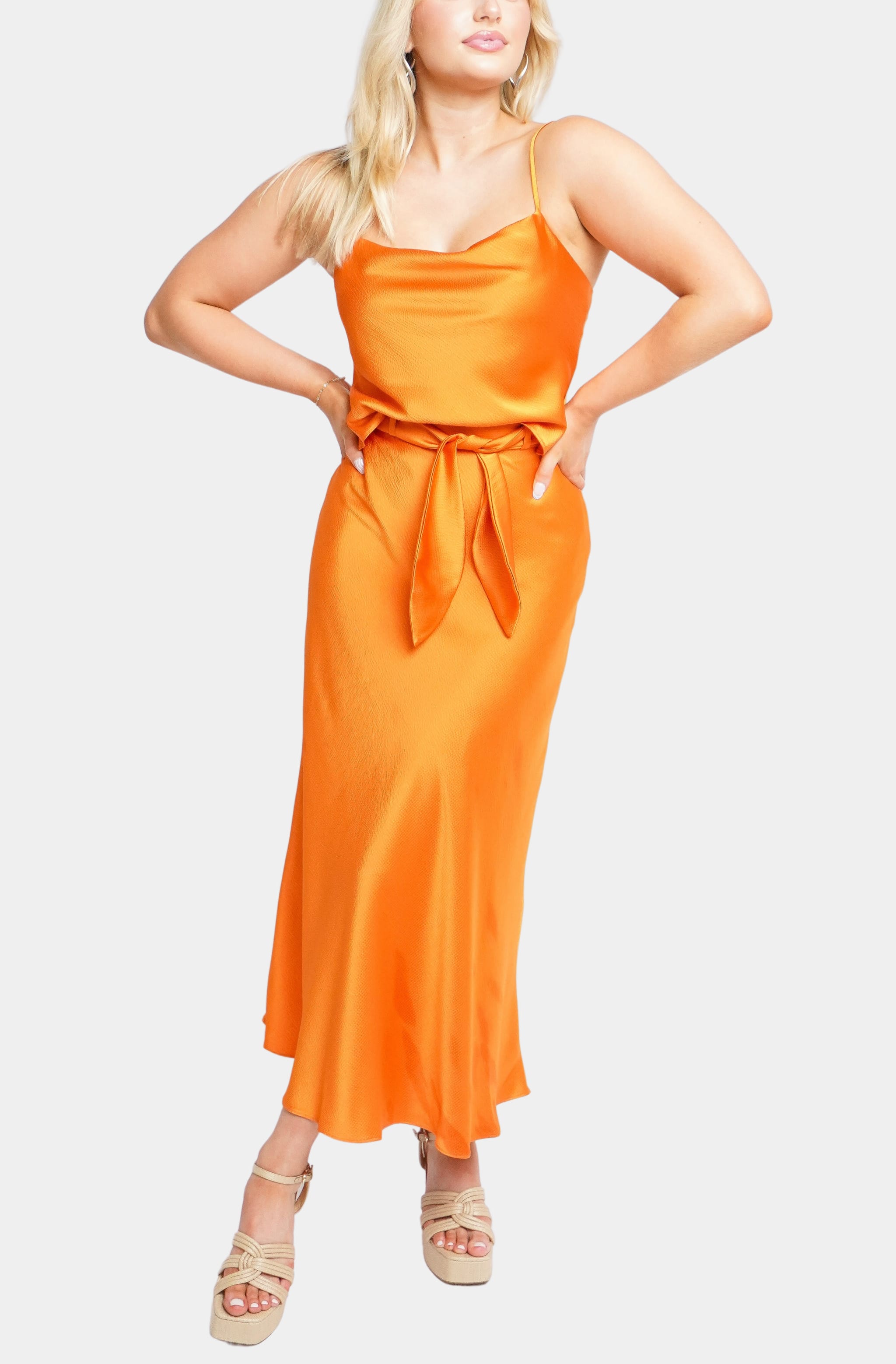 Orange Ava Top with matching skirt, angled view
