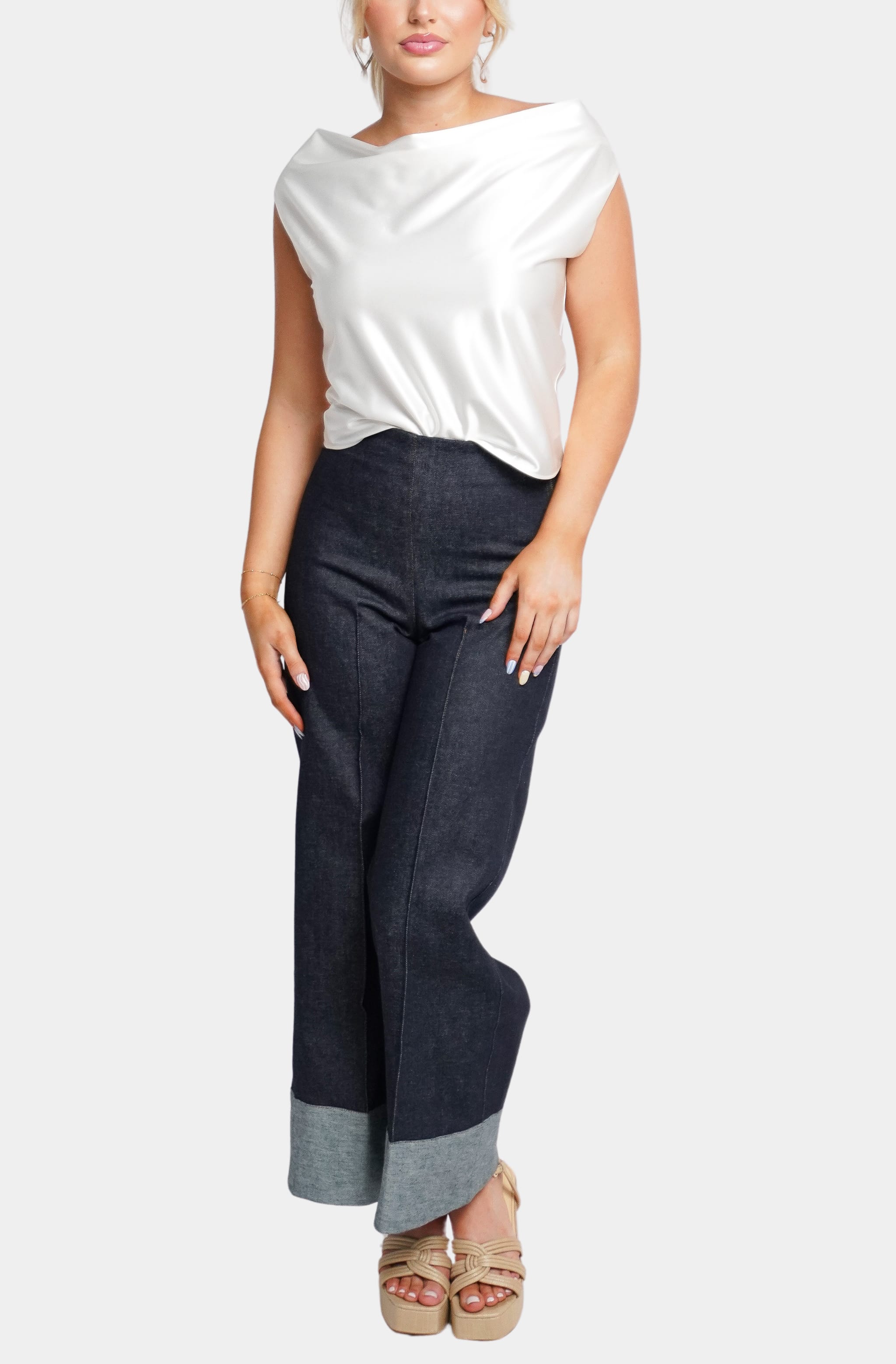 White satin Isle Top paired with dark denim pants