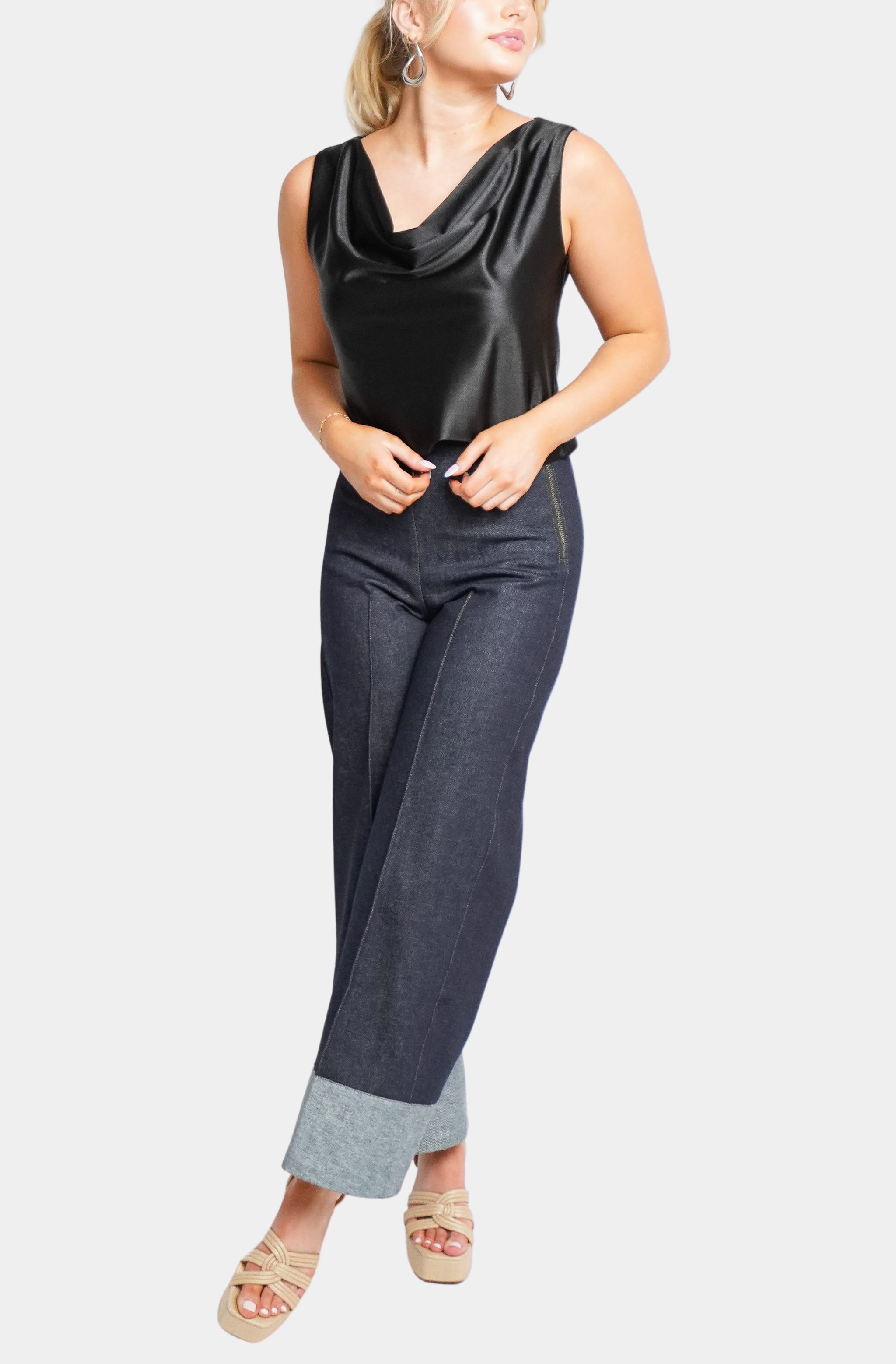 Black satin Isle Top paired with denim pants