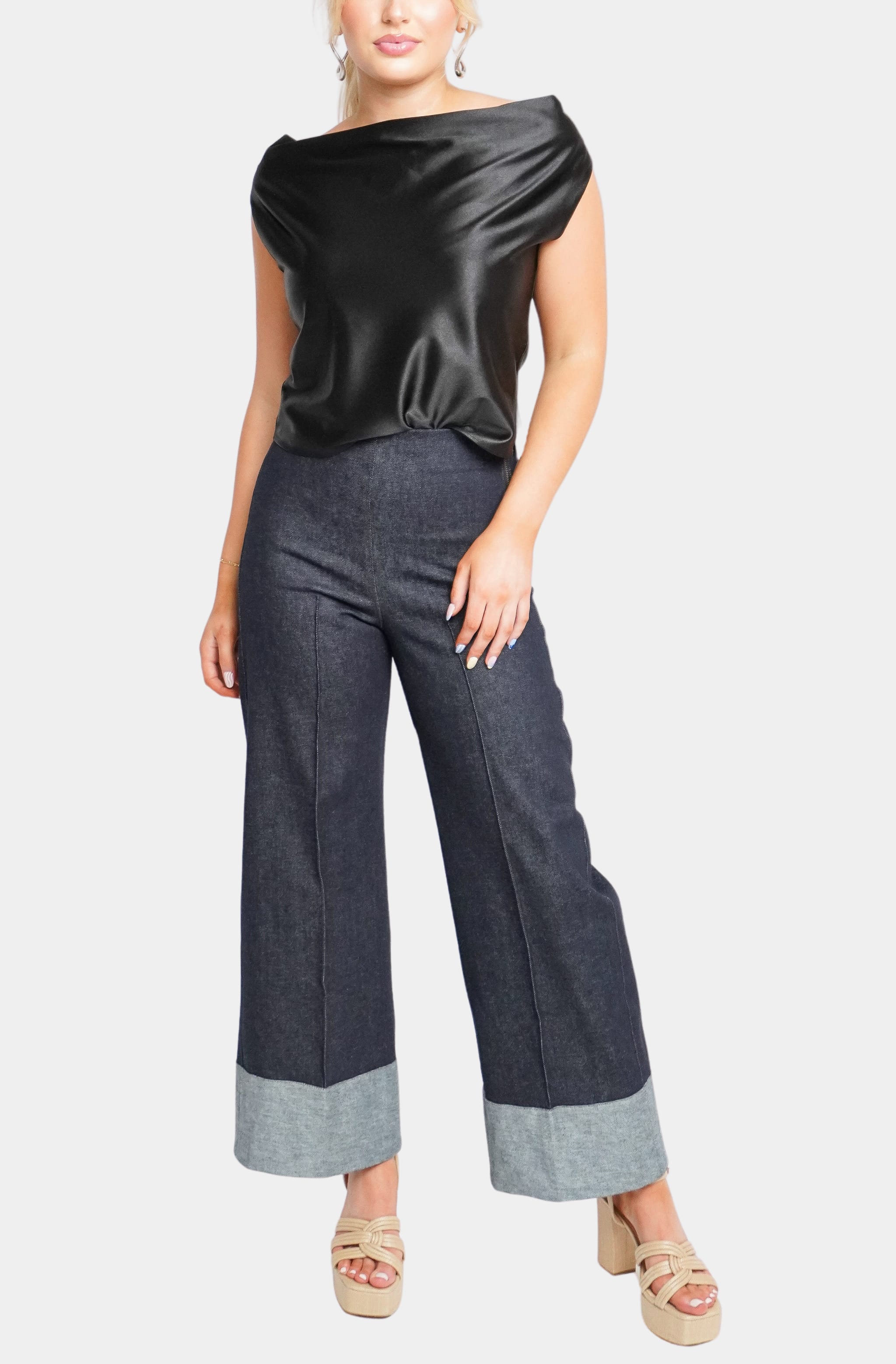 Black satin Isle Top and denim pants ensemble
