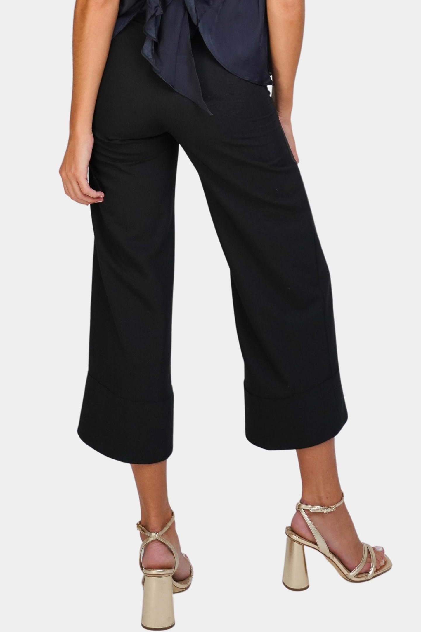 Back view of Brigitte Pant in black