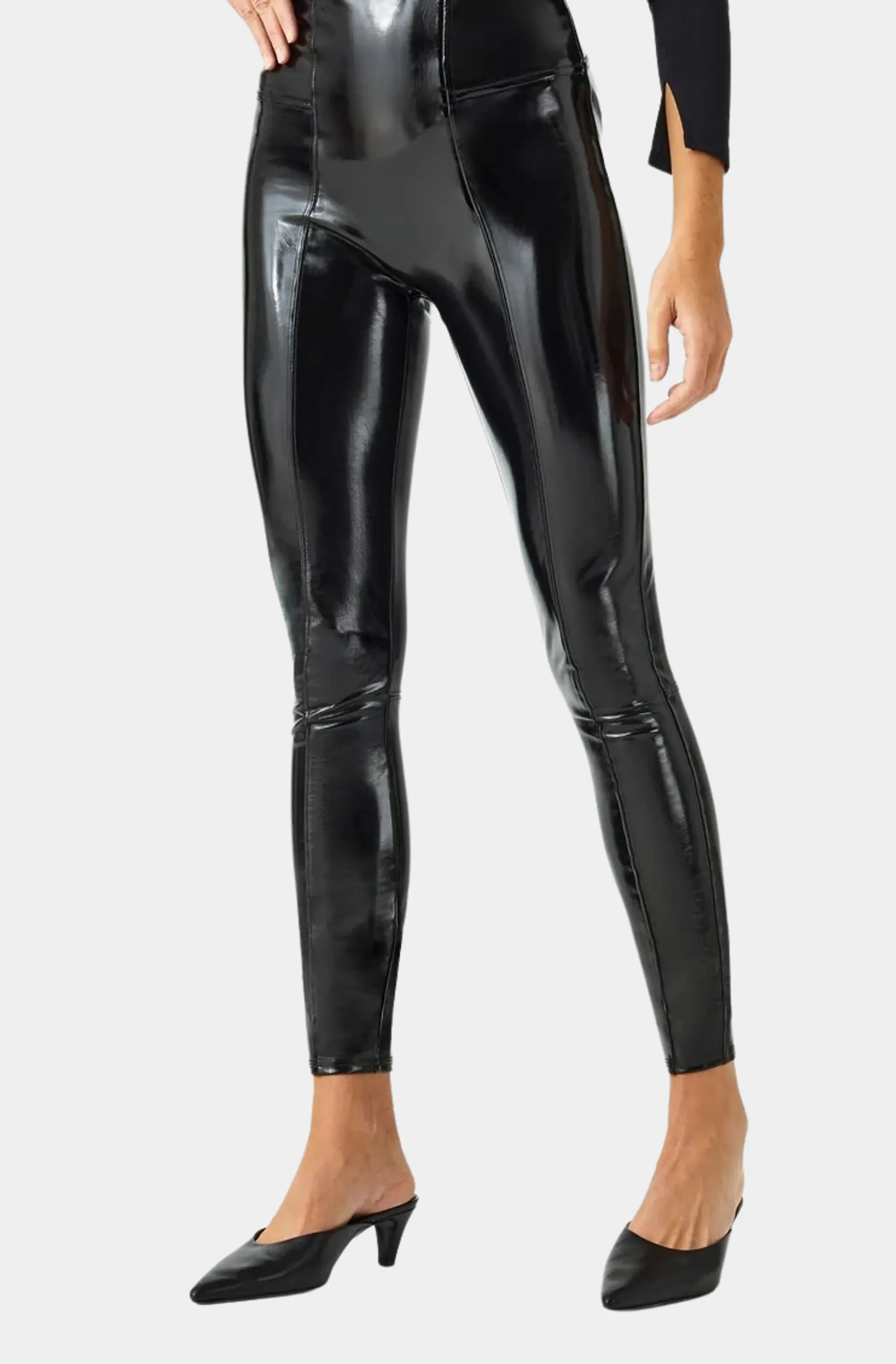 Close-up of shiny black faux leather leggings